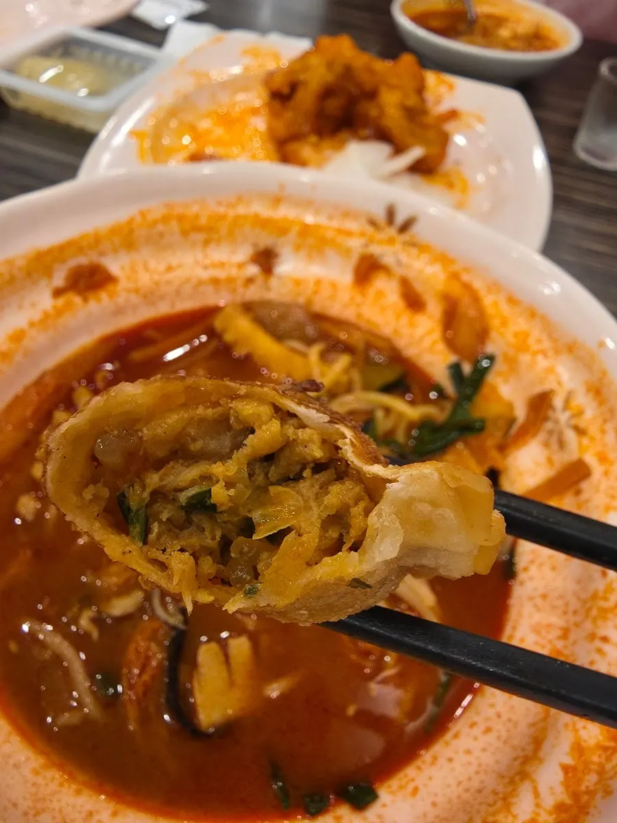 Cross-section of jjamppong fried mandu showing the spicy filling