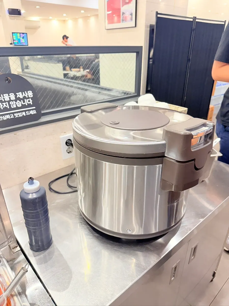 Self-serve bar with bean sprouts, rice, and drinks