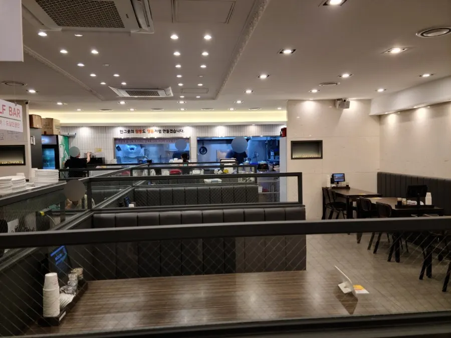 Spacious dining hall with booth-style tables