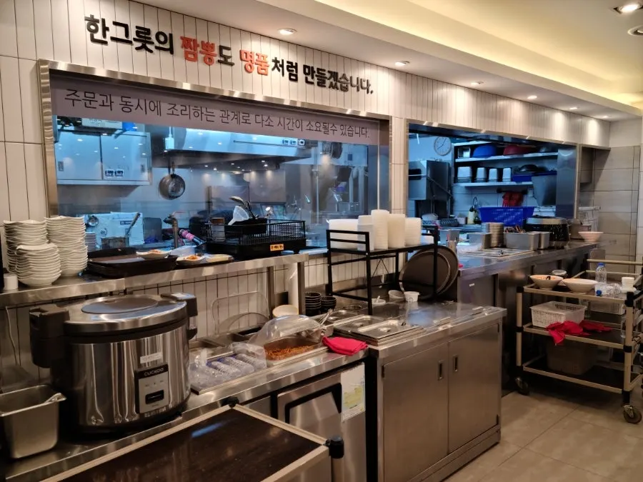Open kitchen where cooking is visible