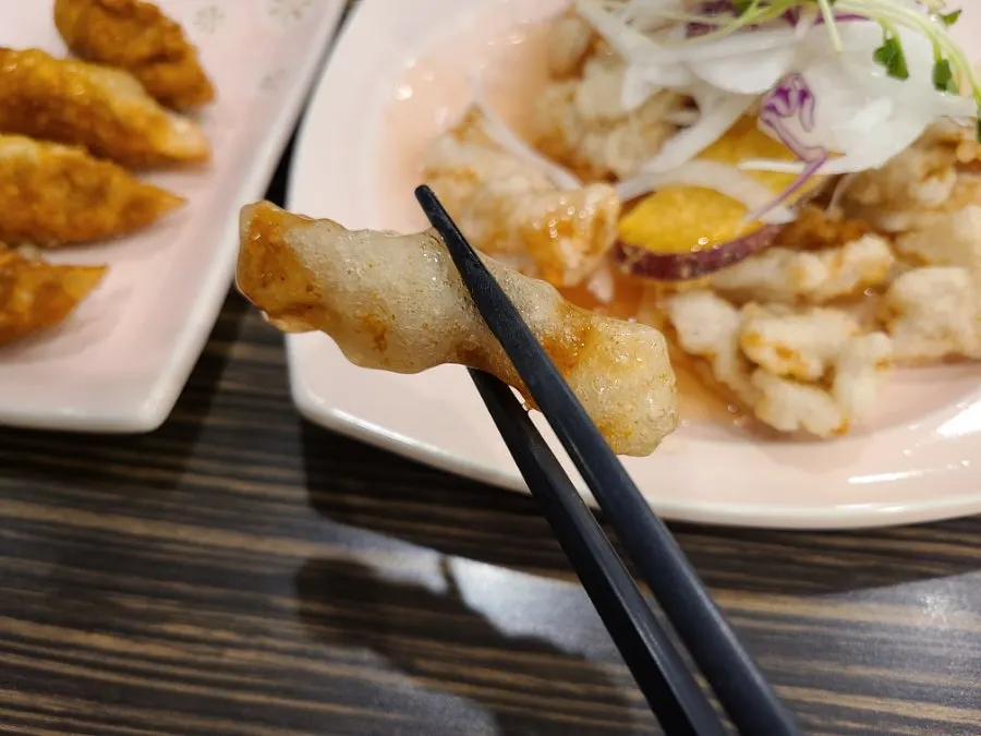 A piece of tangsuyuk eaten plain without sauce