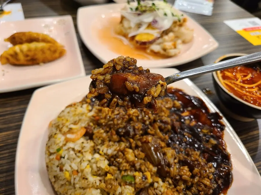 Shrimp fried rice served with jjajang sauce on the side