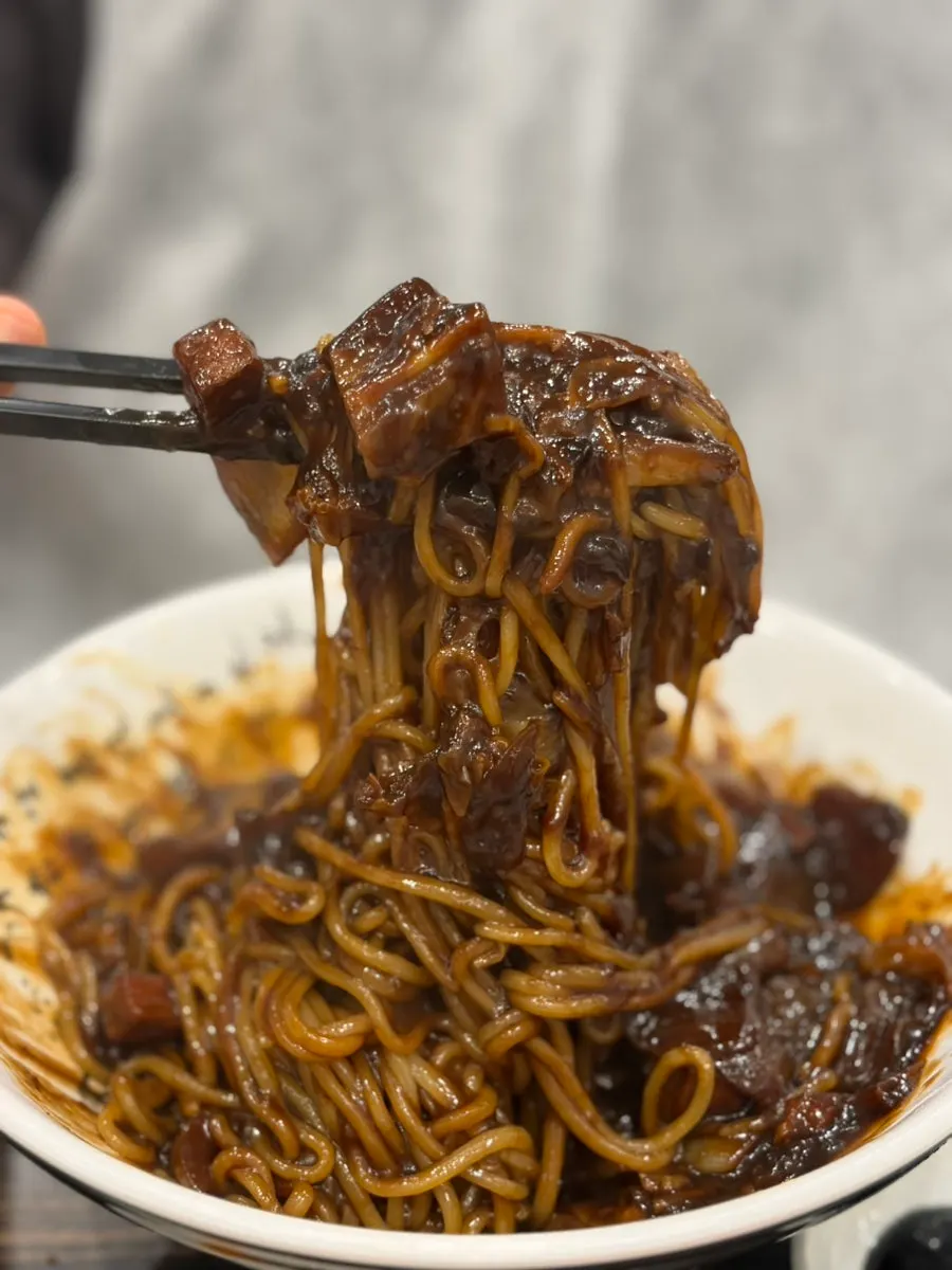 Thin white danmuji served with jjajangmyeon