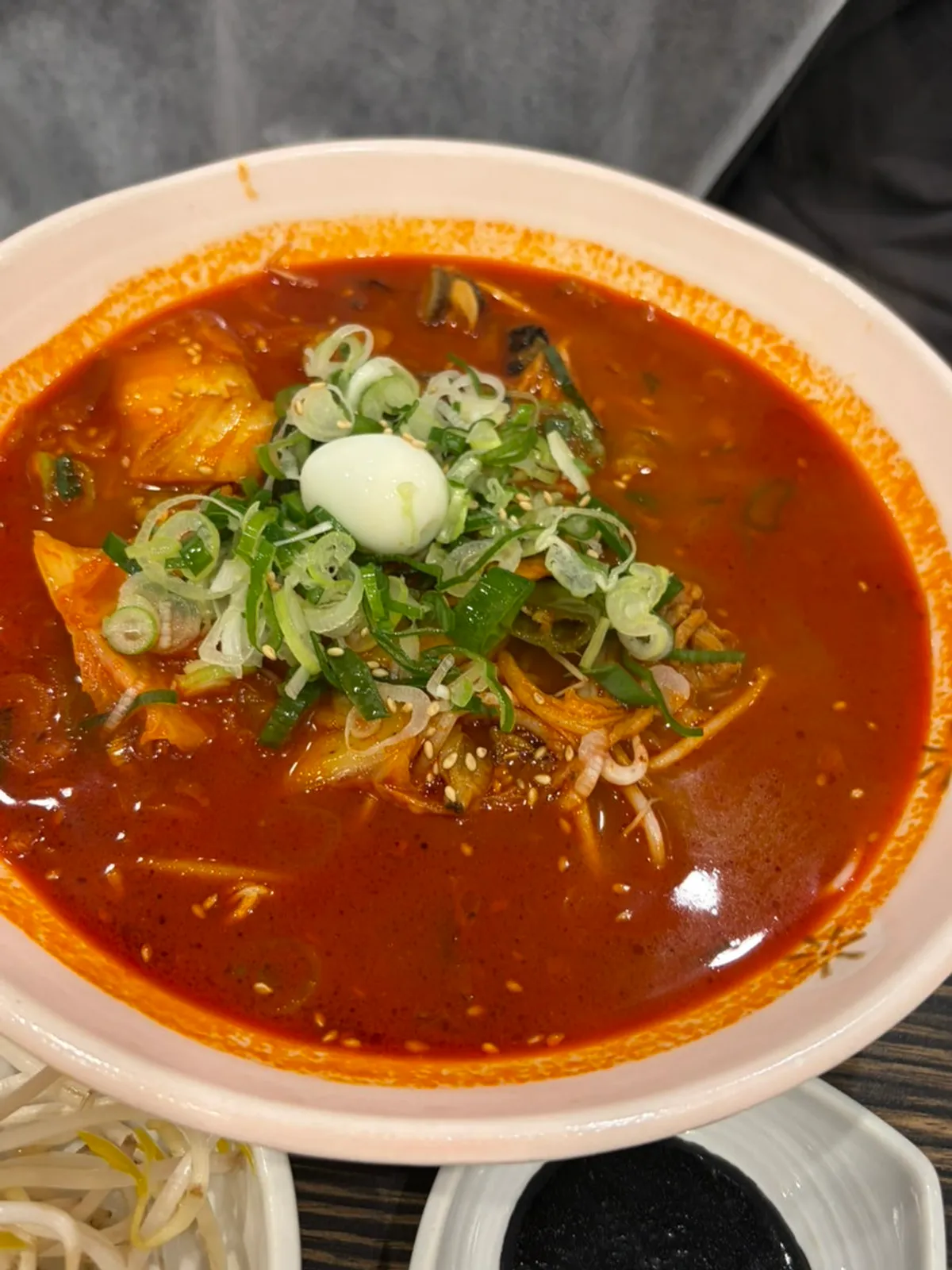 Rice noodle jjamppong topped with a quail egg