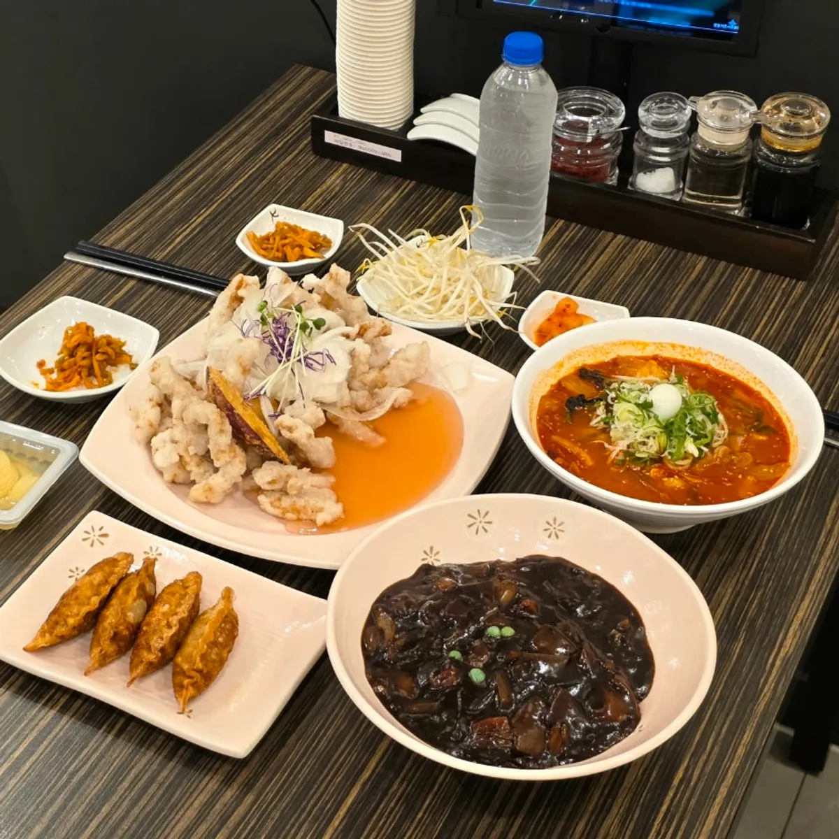 Full table spread with sweet rice tangsuyuk and meal dishes