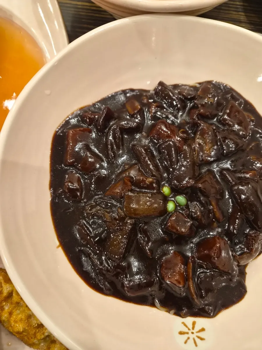 Dipping tangsuyuk into sauce