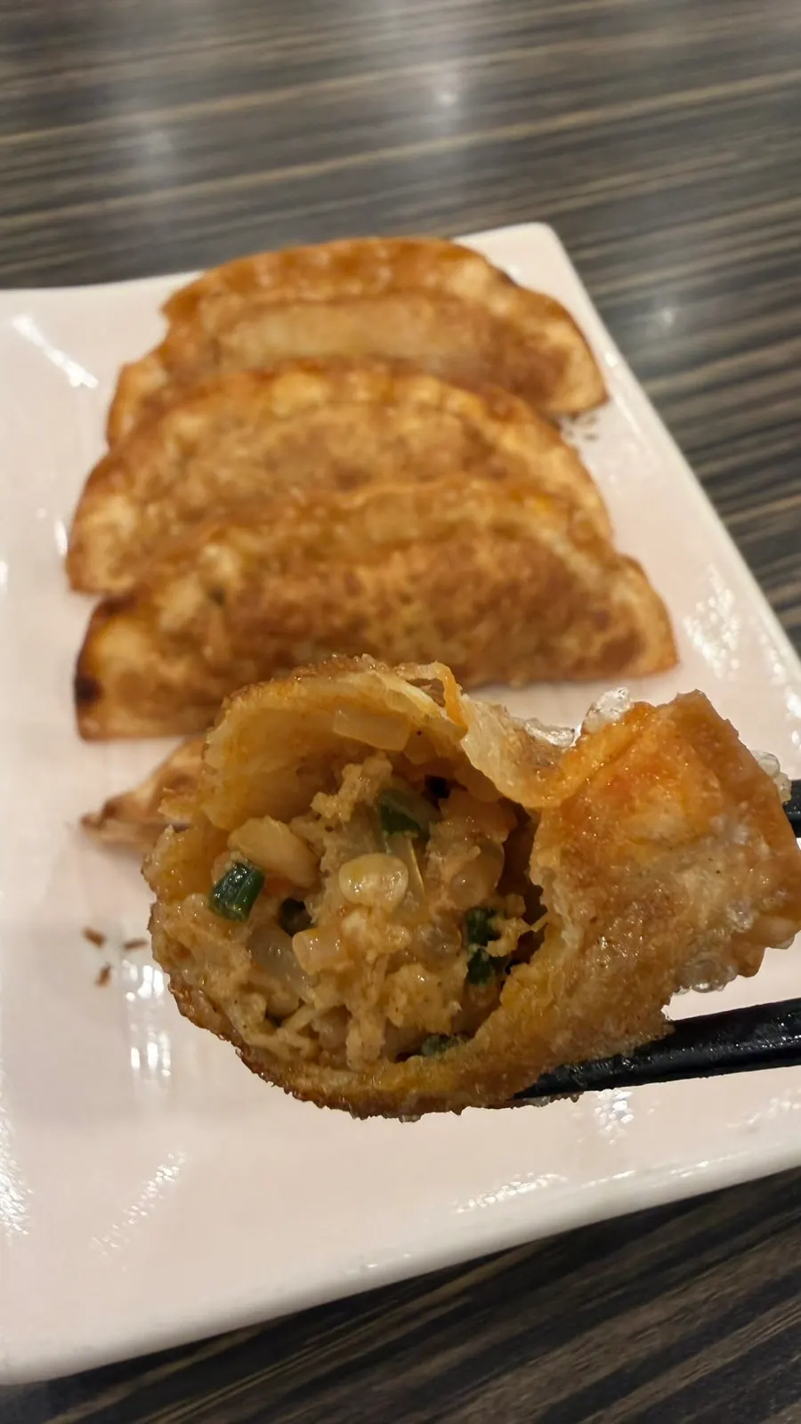 Jjamppong mandu cut in half, showing the filling