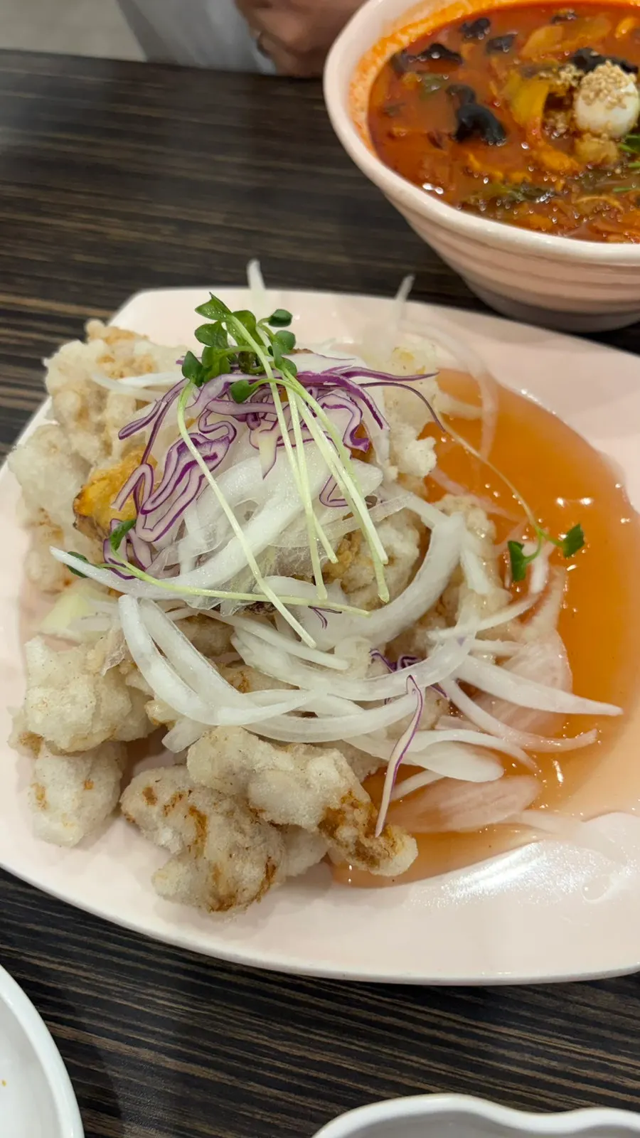 Jjamppong fried mandu cut in half showing the filling