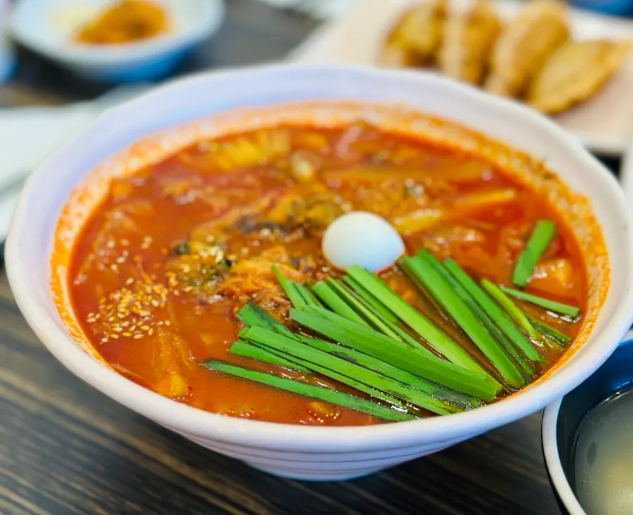 A bowl of jjamppong with a sharp, spicy broth
