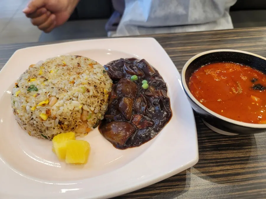 Soondubu jjamppong topped with quail eggs and wood ear mushrooms