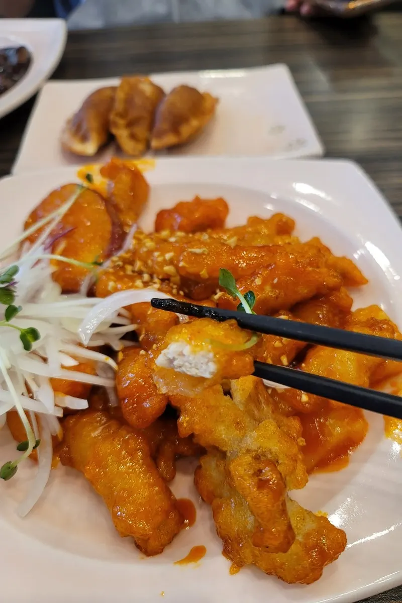 Plate of shrimp fried rice served with pineapple