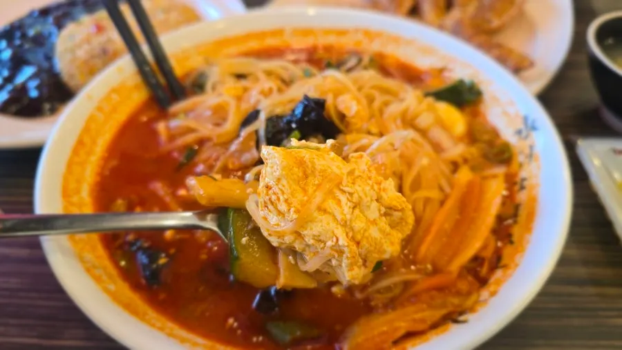 A bowl of rice noodle jjamppong with thick broth