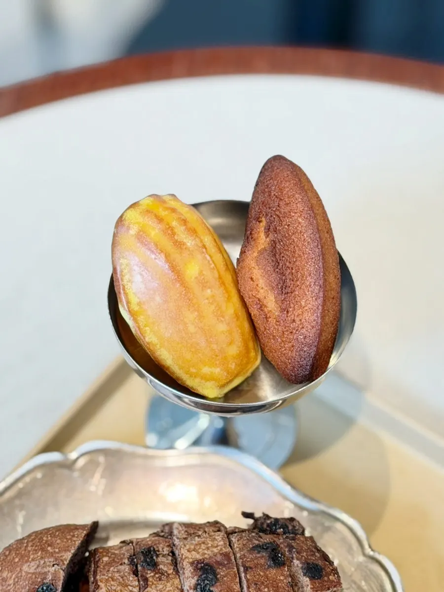 Plain and yuzu lemon madeleines on a plate