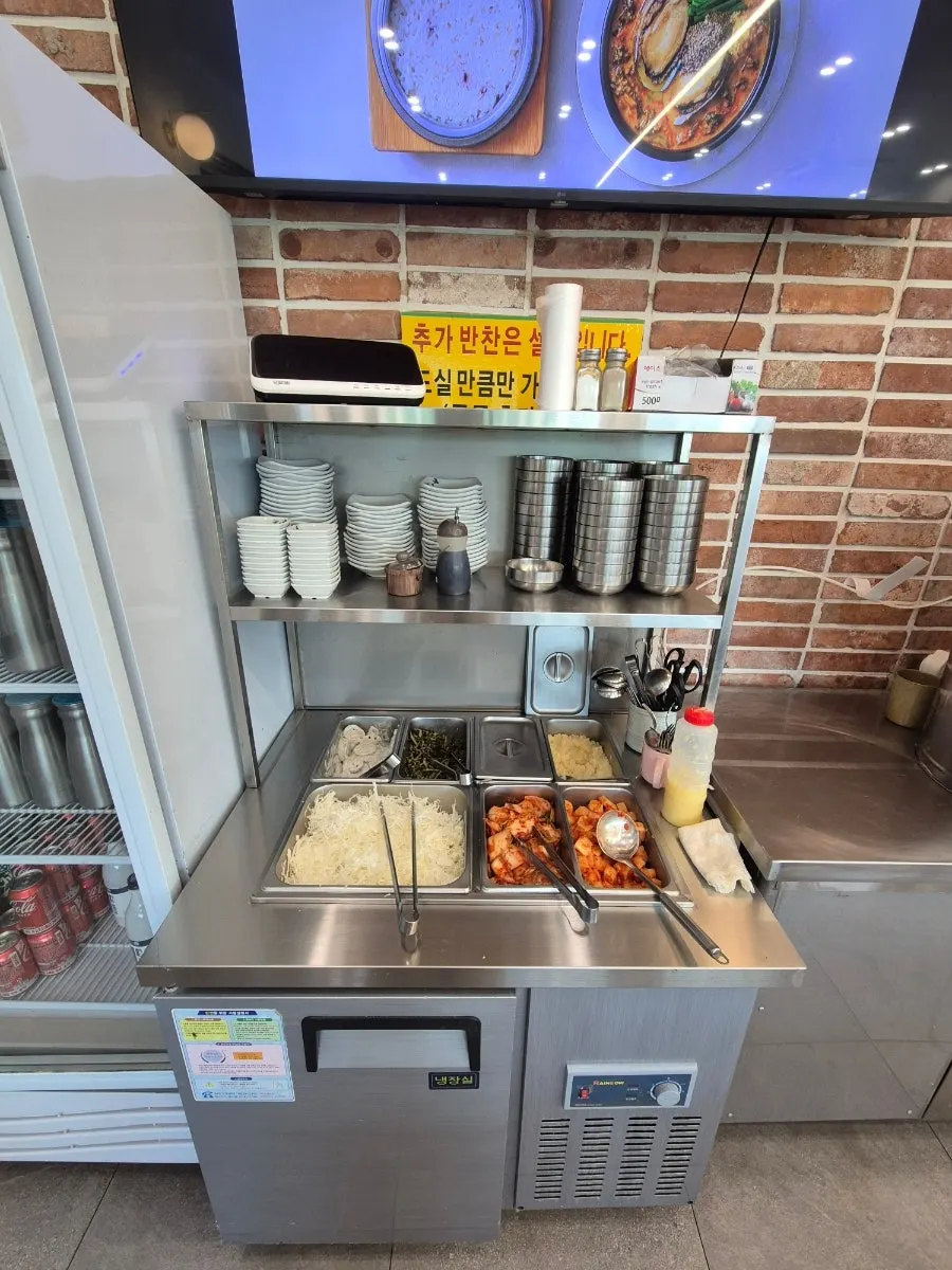 Open kitchen and wood-fired grilled fish cooking area
