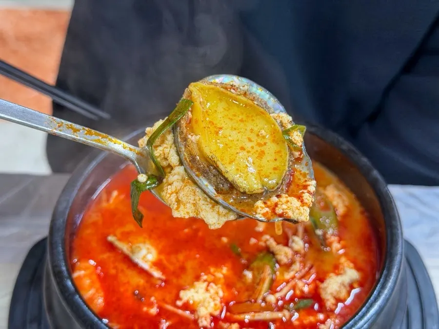 Seafood ingredients inside the jjamppong seafood sundubu