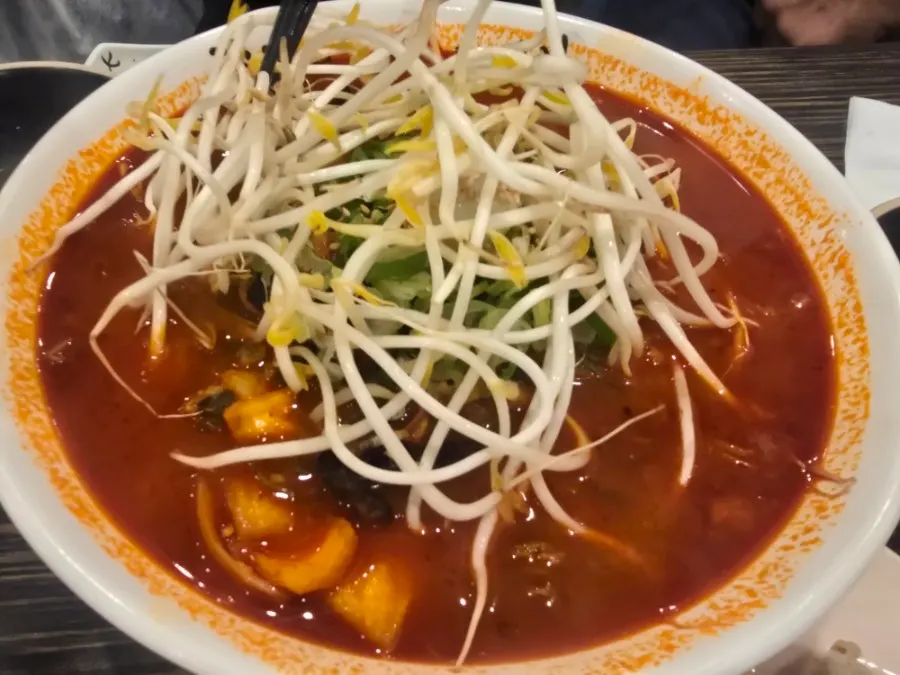 Rice noodle jjamppong topped with bean sprouts