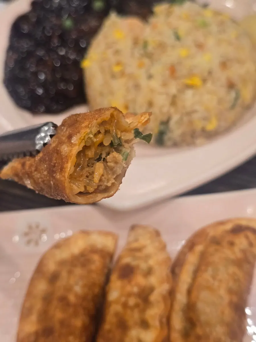 Fried mandu dipped in jjajang sauce
