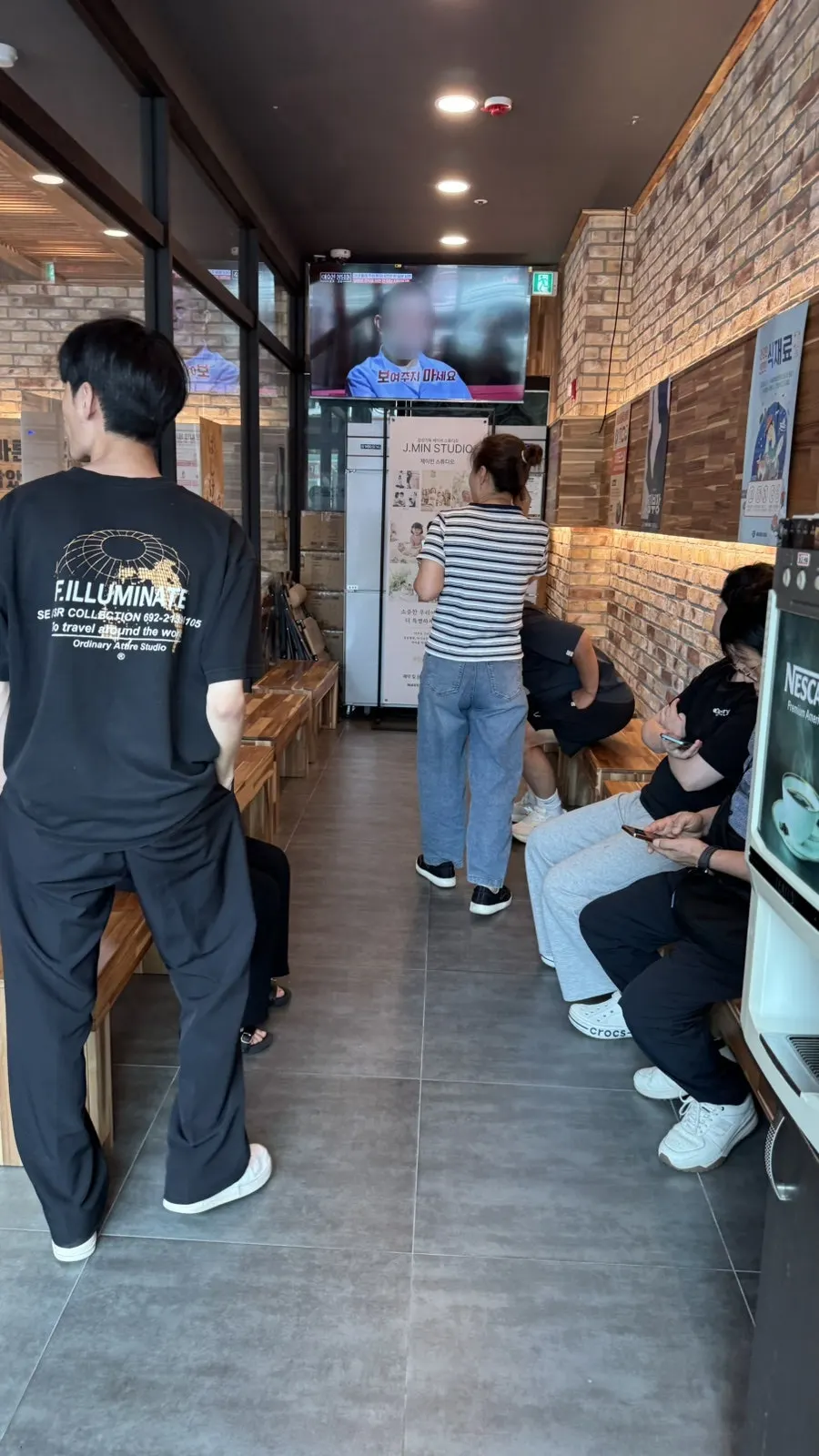 Waitlist sign-in in front of the store before opening