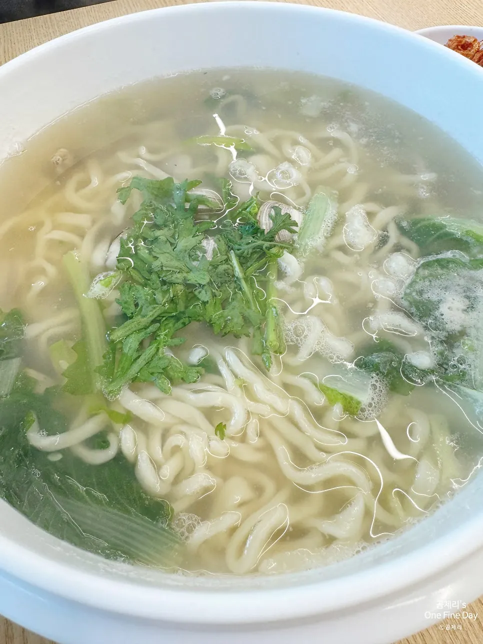 Two servings of dongjuk kalguksu served in a large bowl
