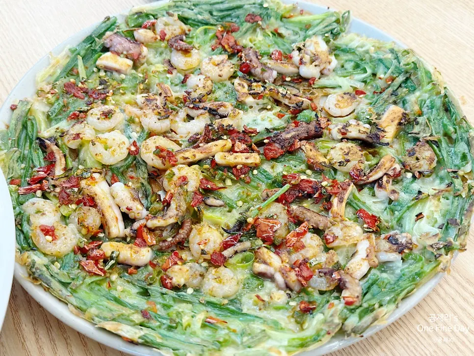 Ohaknae seafood pancake topped with shrimp, squid, and octopus
