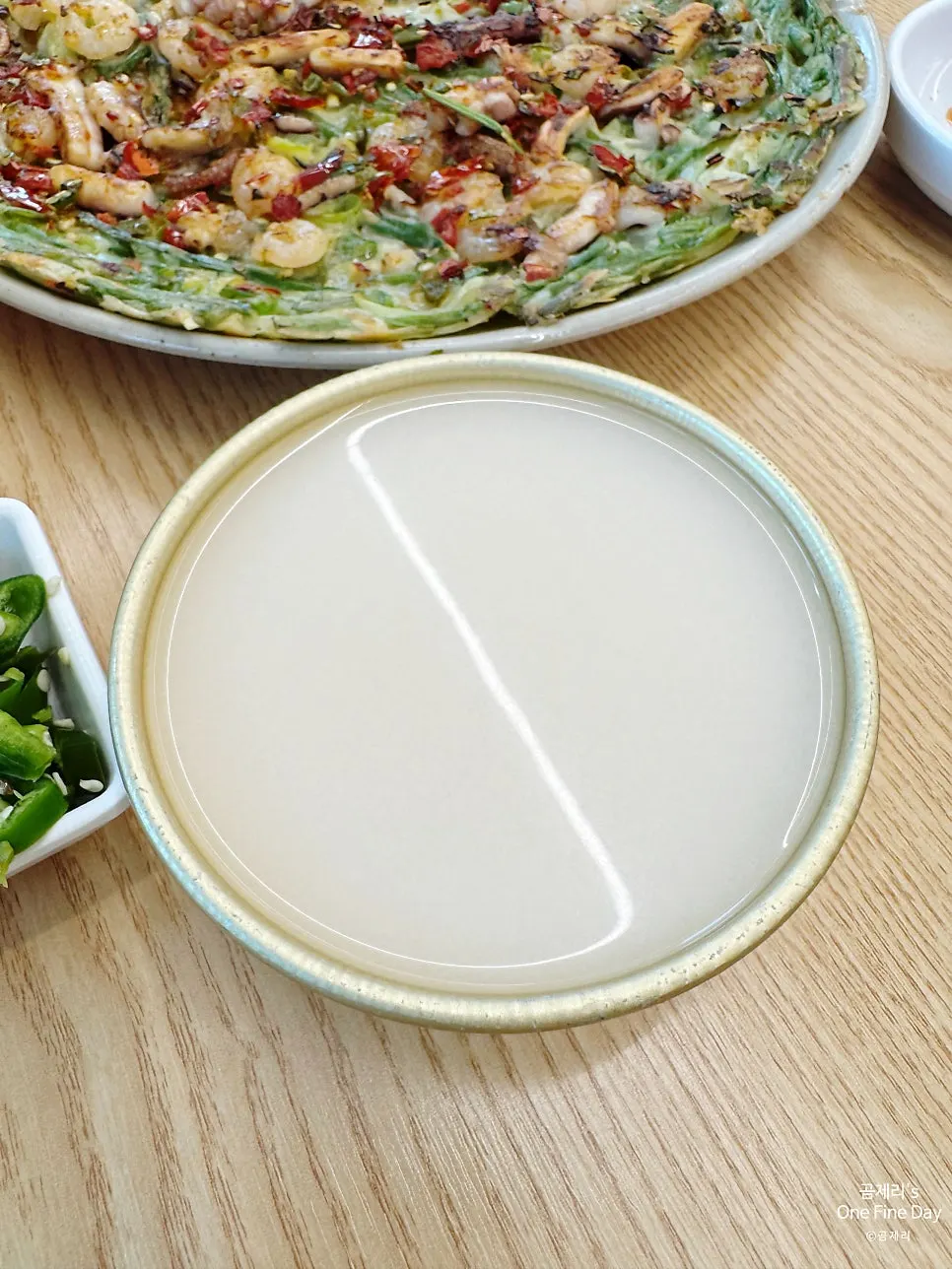 The table setting of kalguksu and pancake near the end of the meal