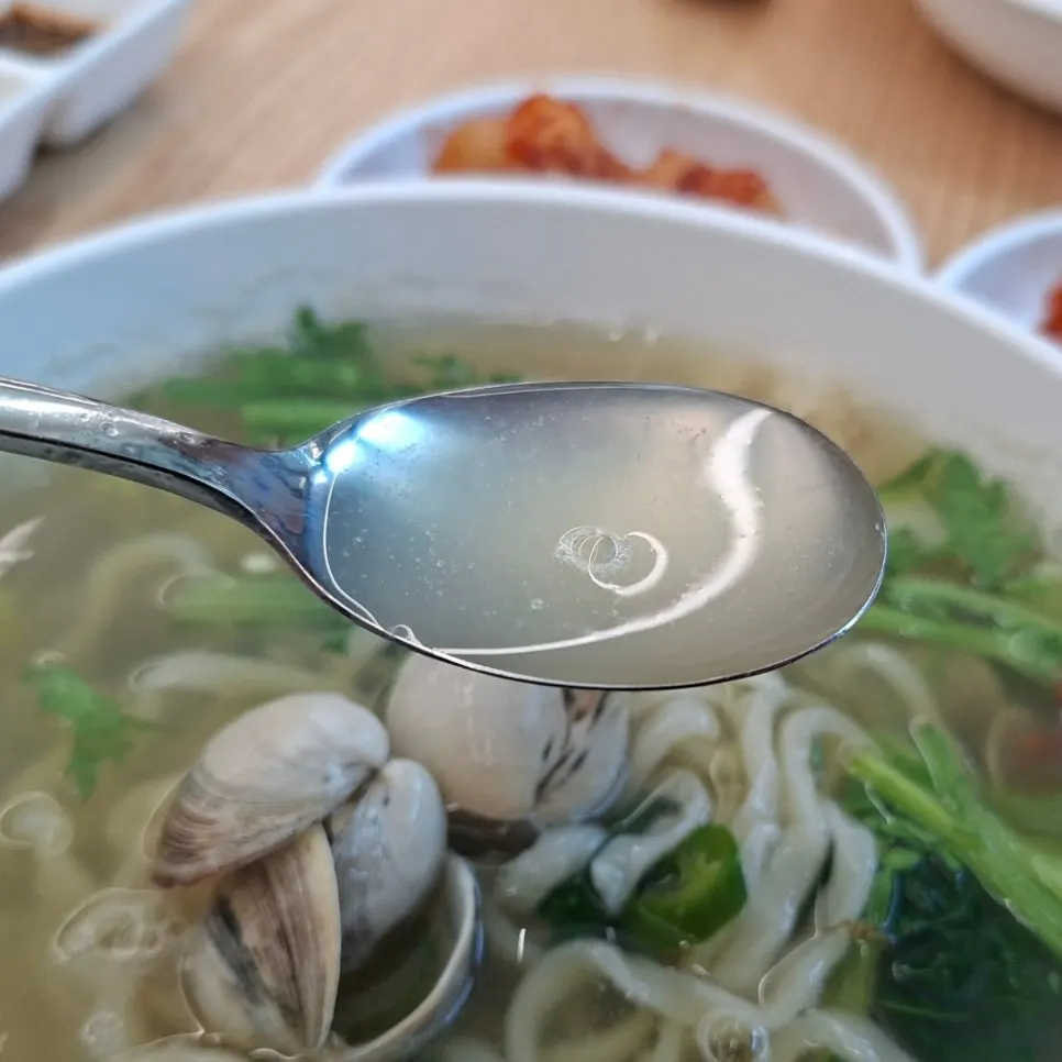 Spicy, fiery broth of the dongjuk kalguksu