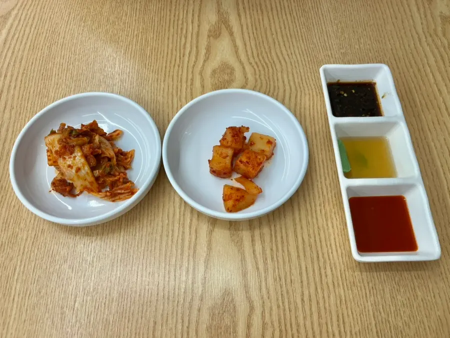 Basic side dishes of kimchi, diced radish kimchi, and pancake sauce
