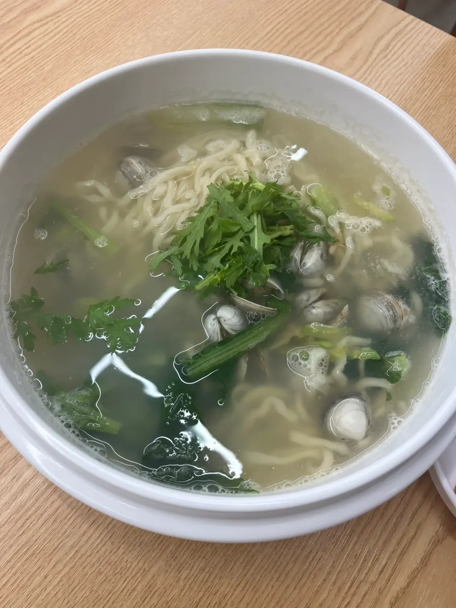 Clam kalguksu for two served whole in one pot