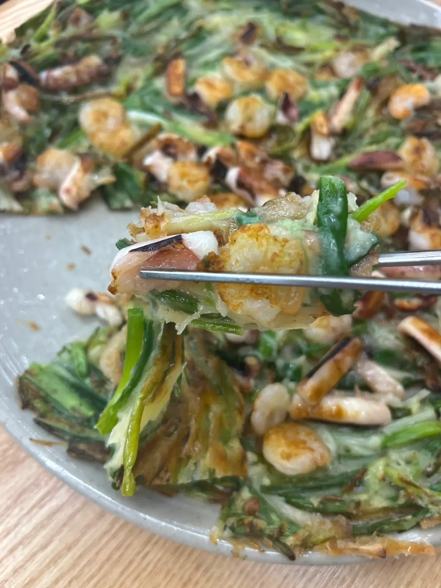 Cross-section of seafood pancake with squid and shrimp
