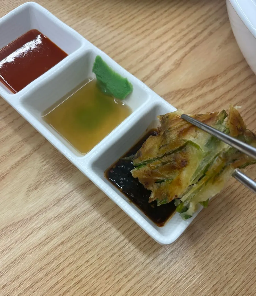 Three sauces served alongside the pancake