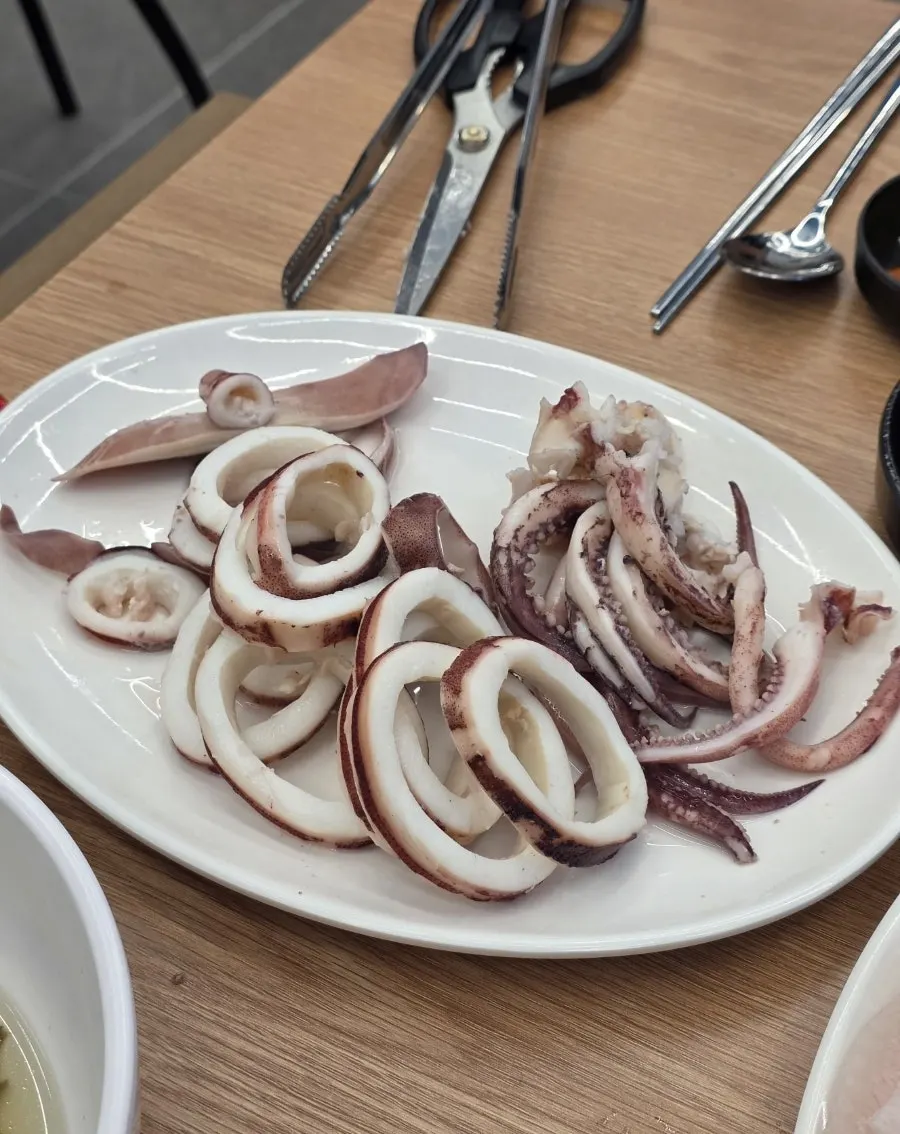A plate of boiled squid served with chojang sauce