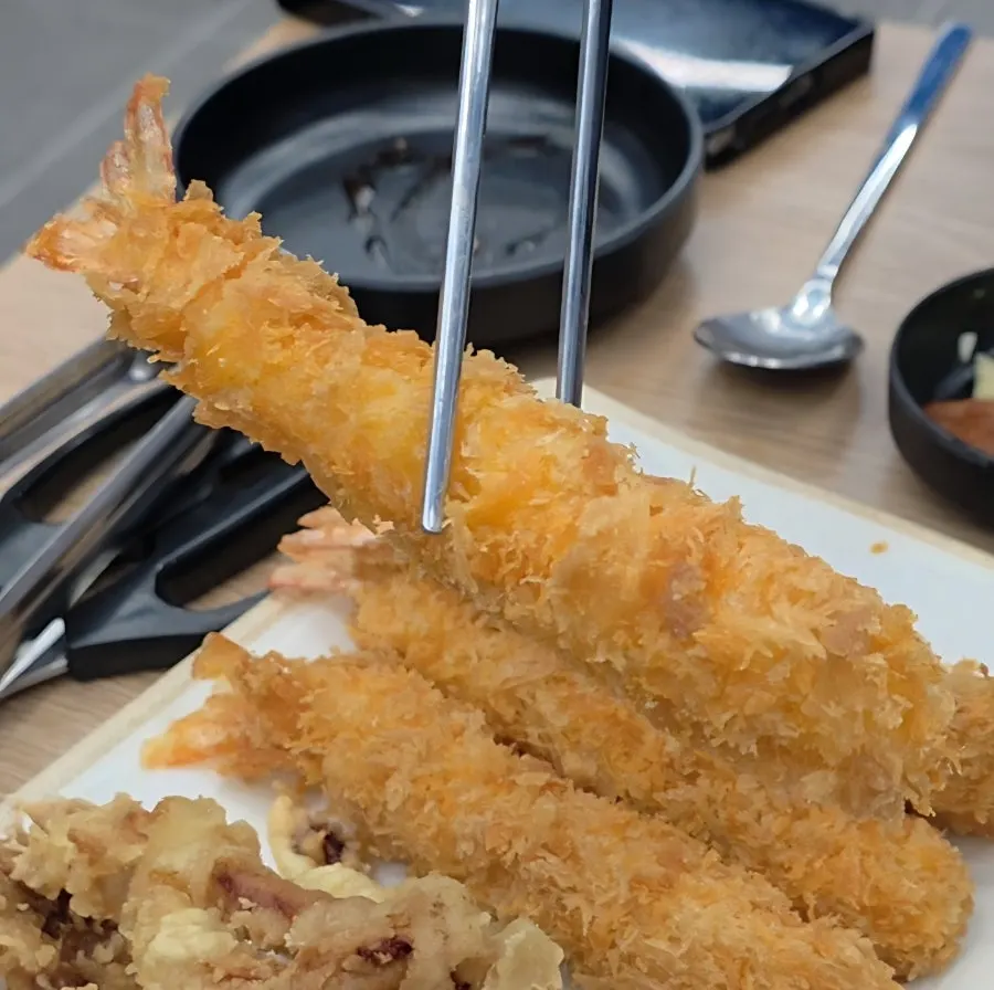 Half-and-half fried shrimp and squid on a plate
