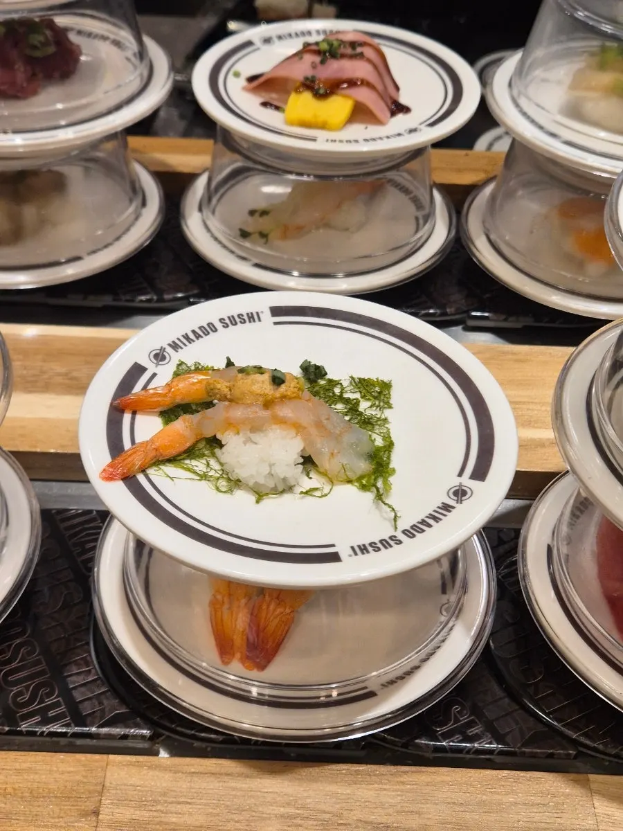 Abalone sushi topped with a large chunk of abalone