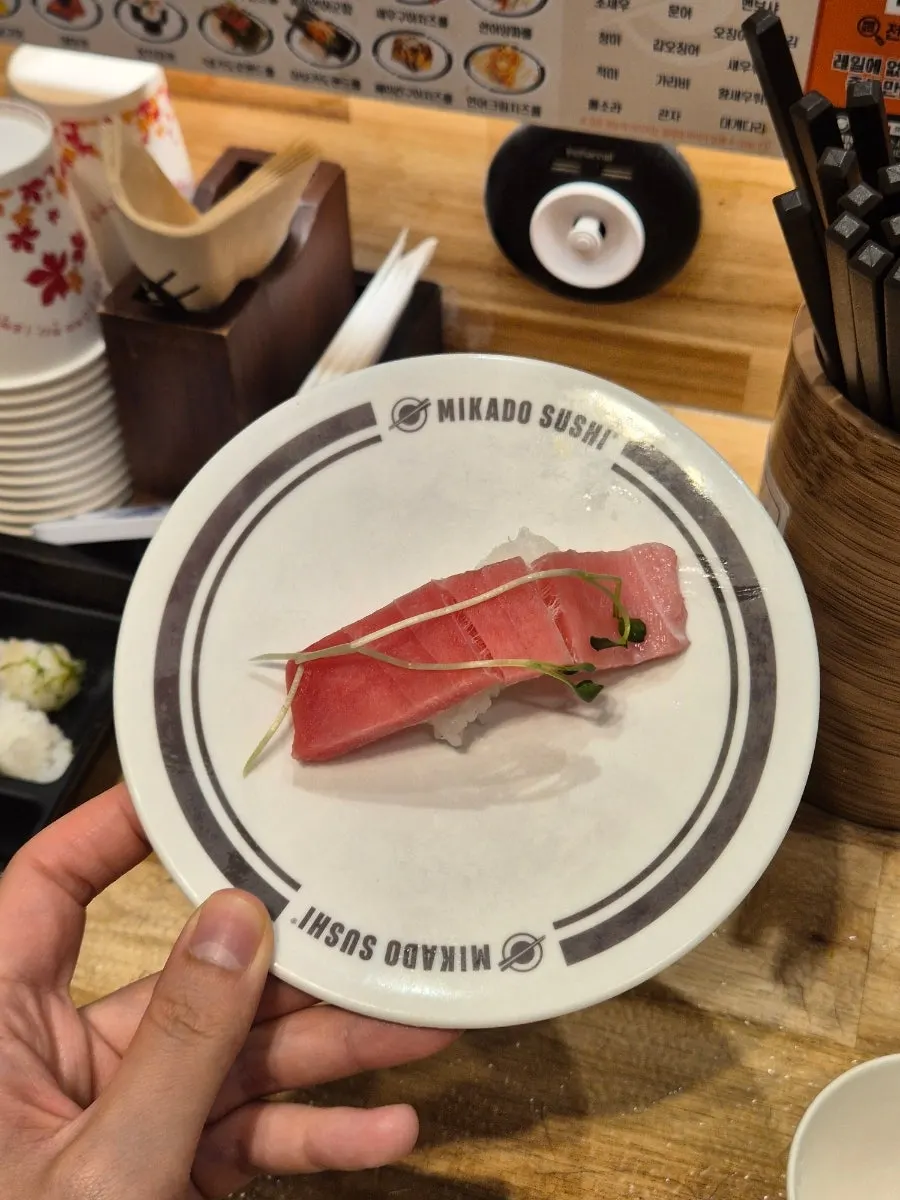 A plate with several different kinds of sushi