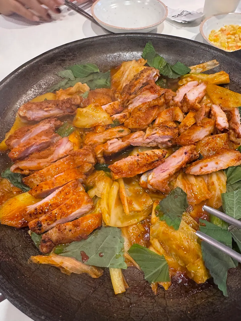 Bone-in dakgalbi being served