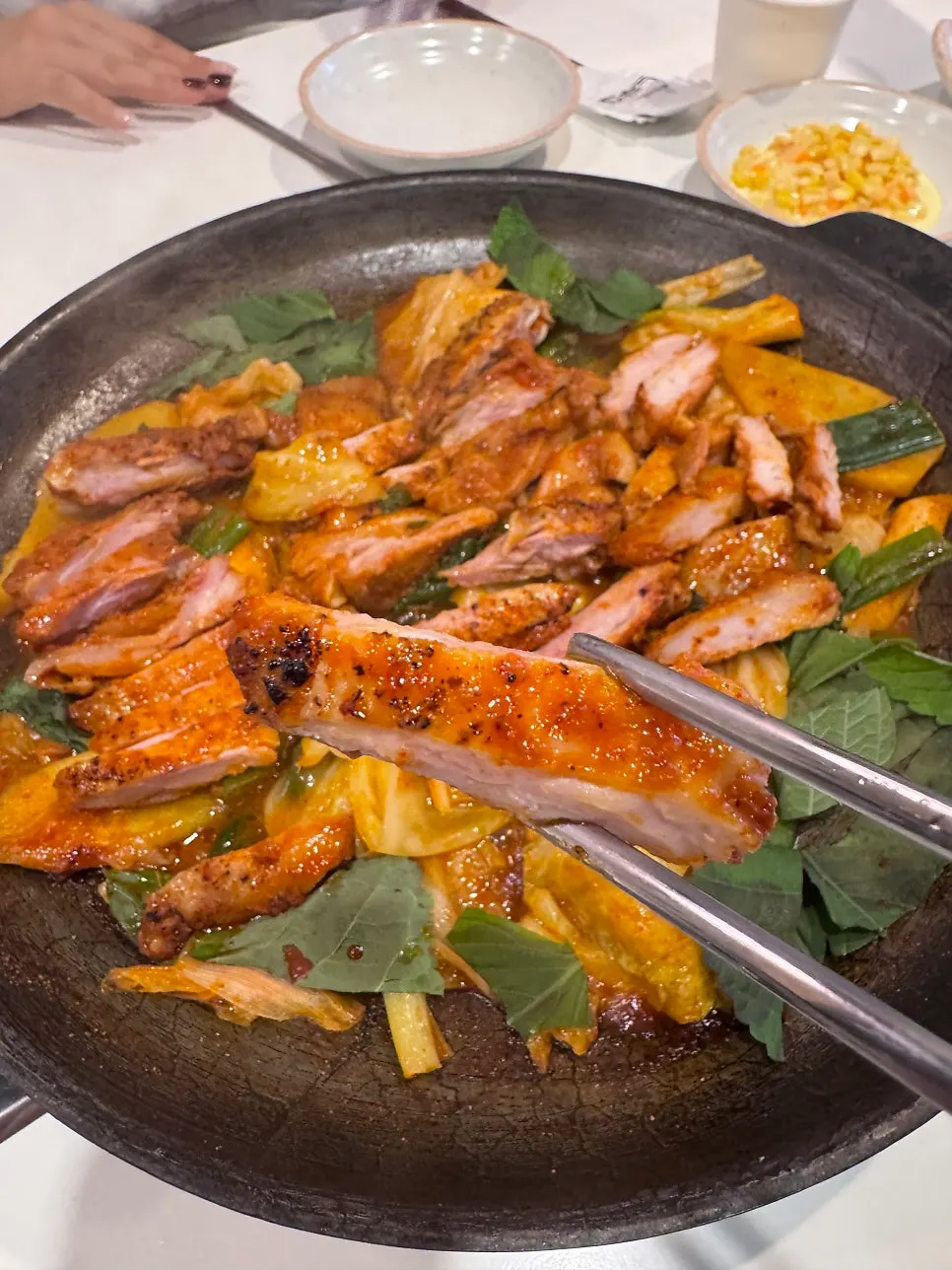 Professional griller cooking dakgalbi