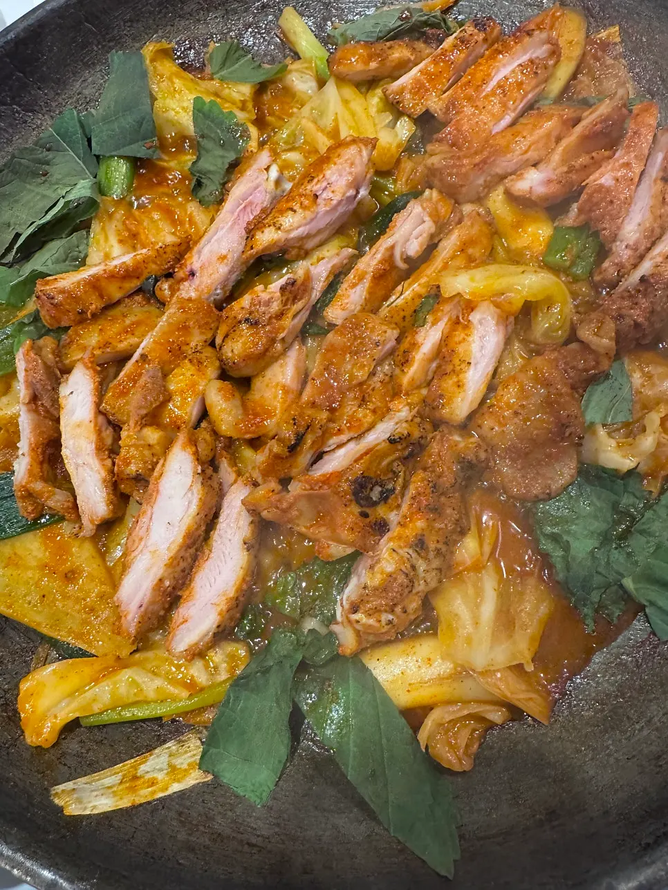 Dakgalbi in a cast-iron pan