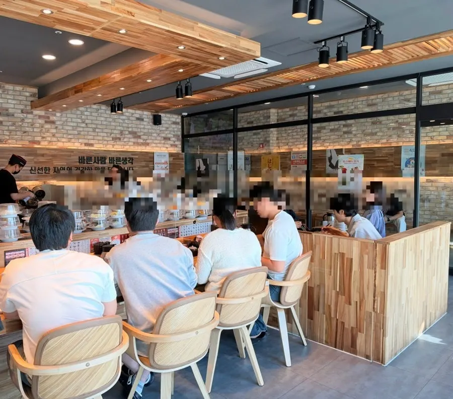Bar table seating in front of the conveyor belt, great for two
