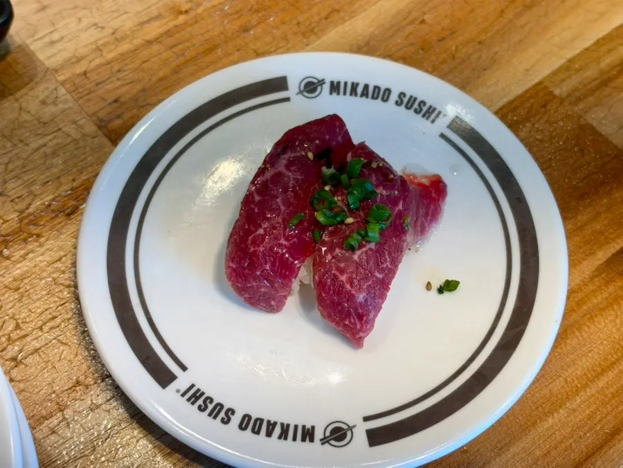 A plate of meat-based sushi at Mikado Sushi