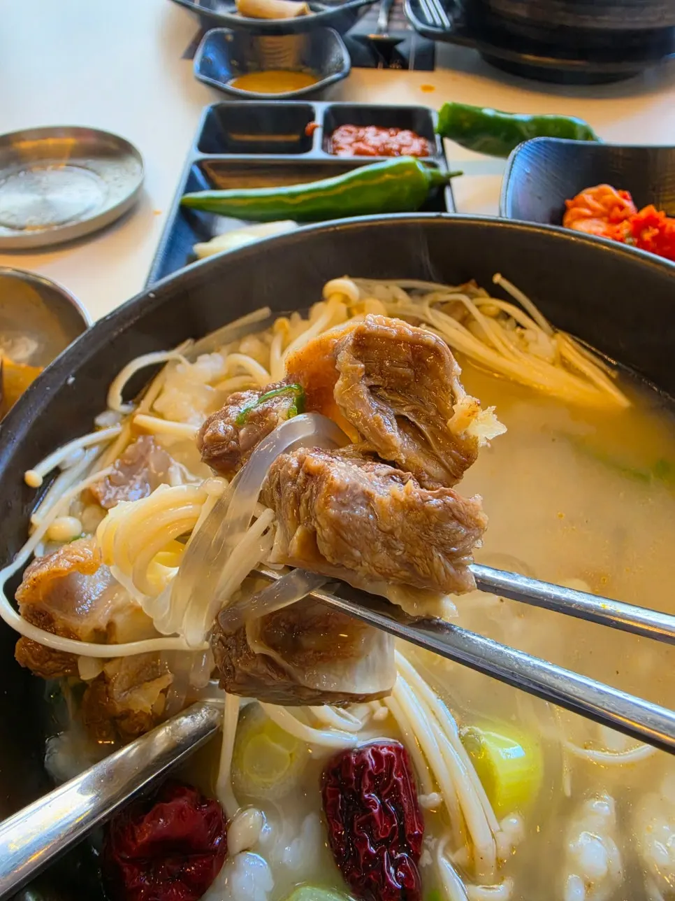 Clear yet rich galbitang broth with a bowl of rice