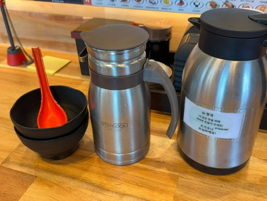 Hot broth and water station