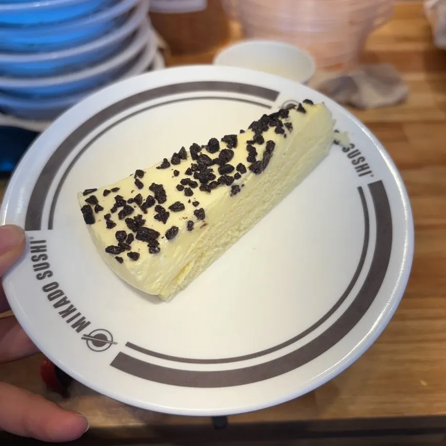Conveyor-belt sushi plates piled on the table