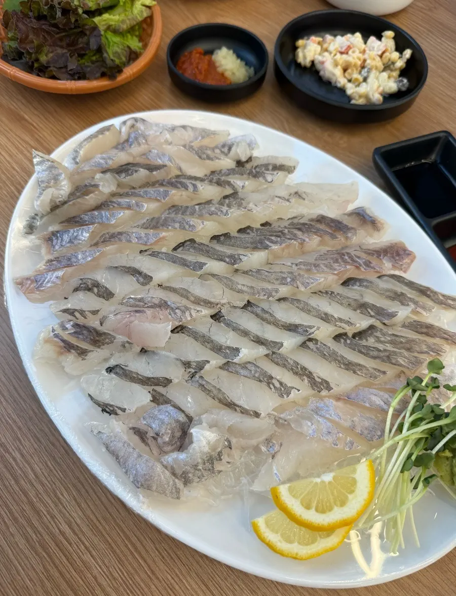 Large plate packed with rockfish sashimi