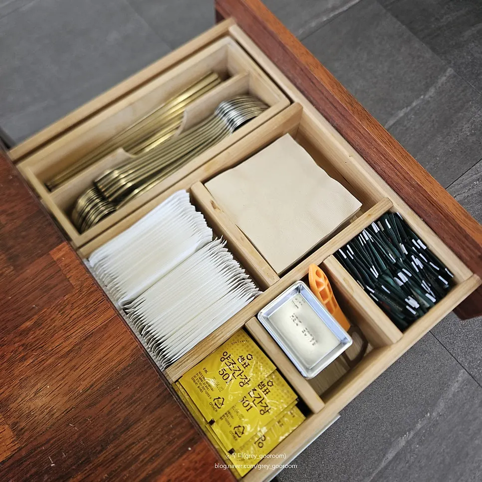 Table set up with table-order tablet and sauces
