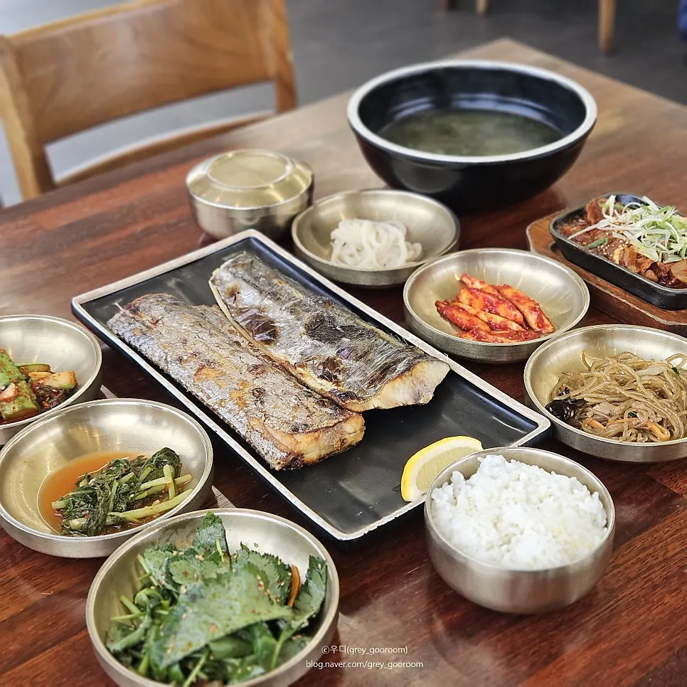 Two grilled fish served side by side