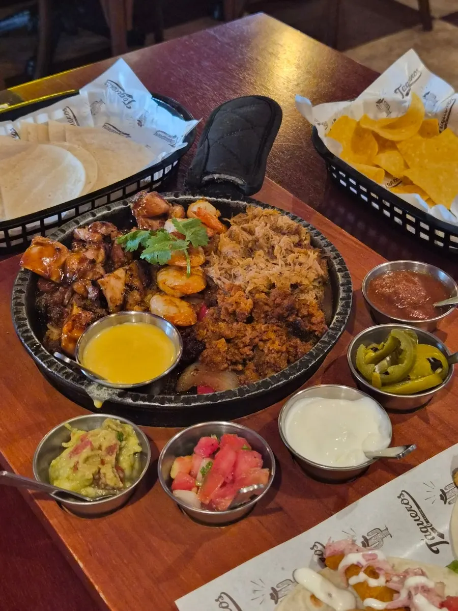 Tacos and fajita on the table at Taqueros Magok Main Branch