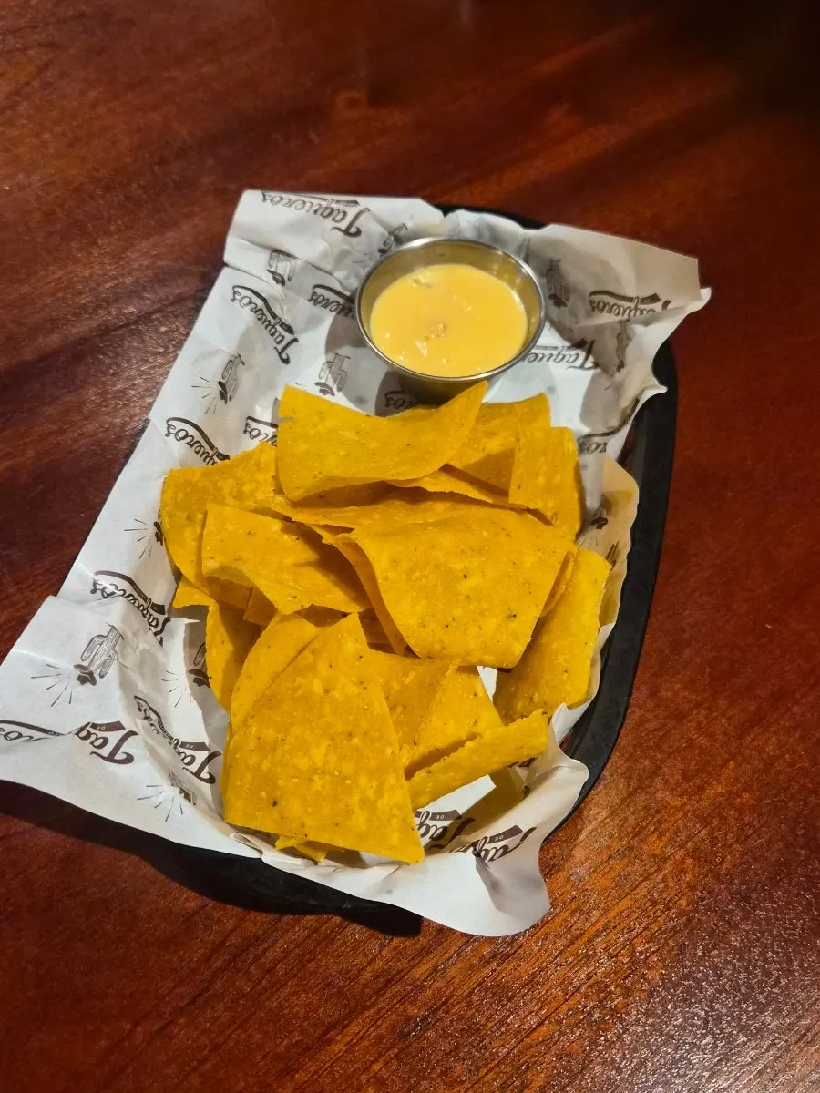 Nachos and cheese sauce served by default