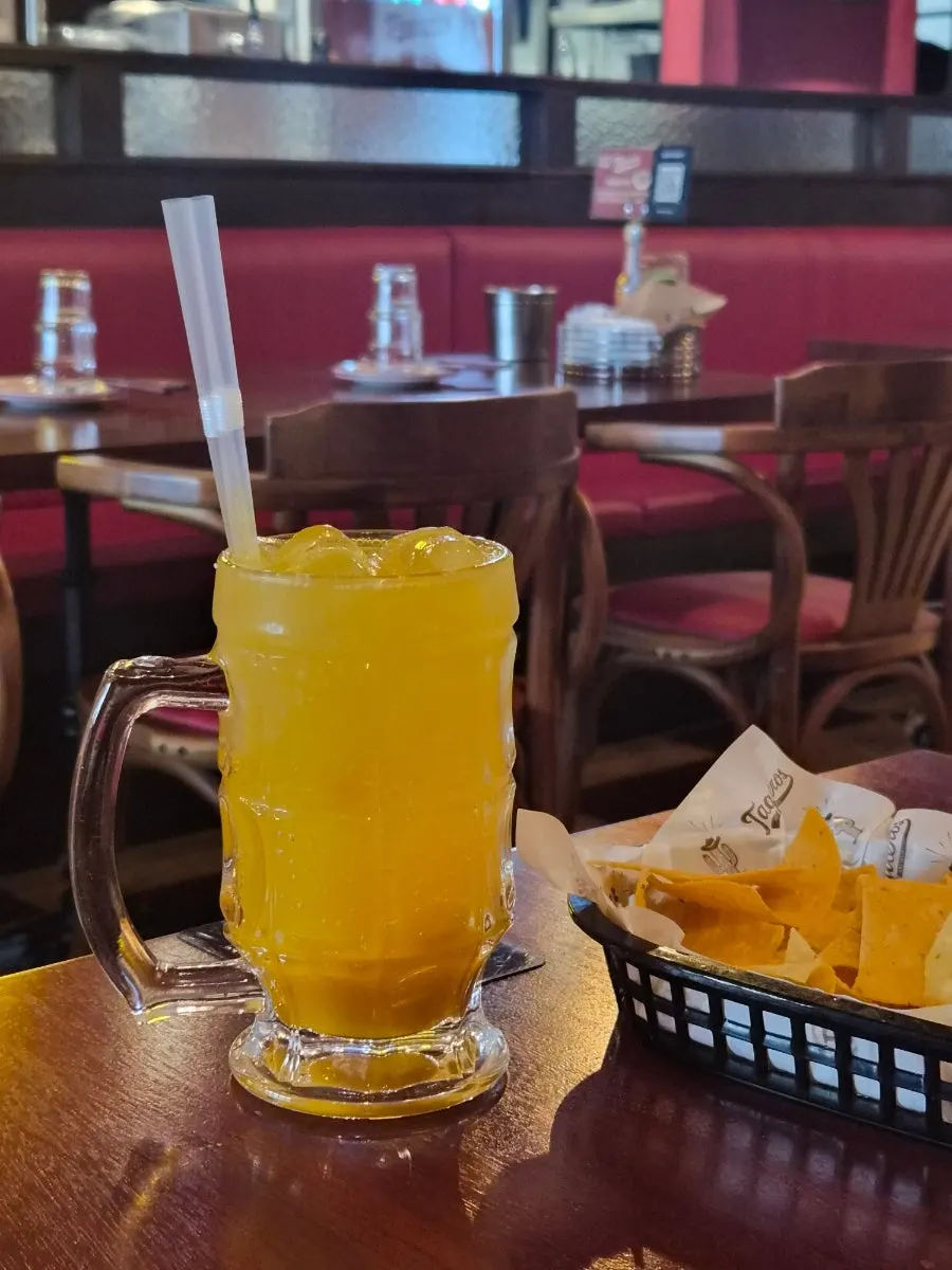 A glass of apple mango ade at Taqueros