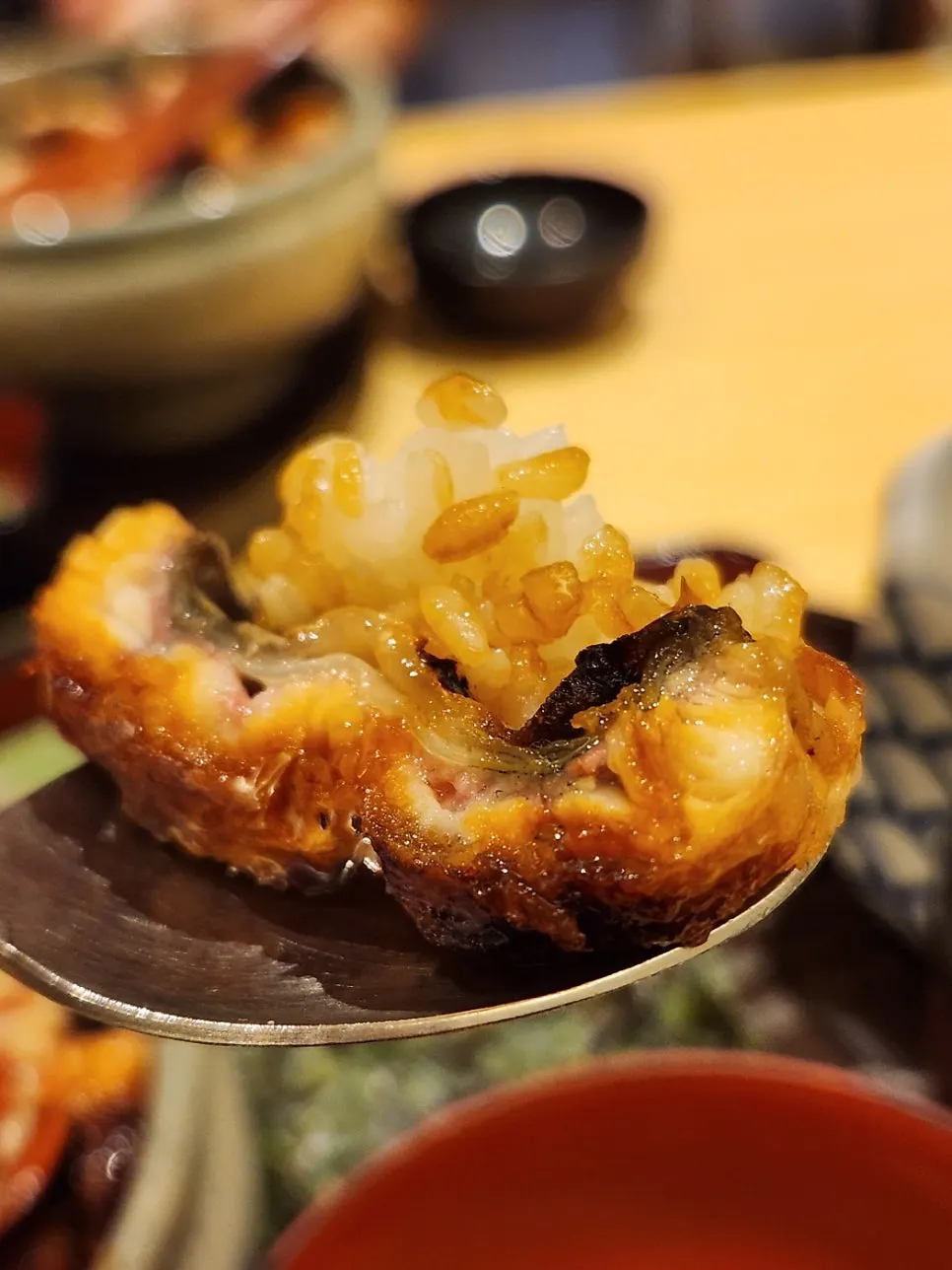 A spoonful of eel rice bowl lifted up