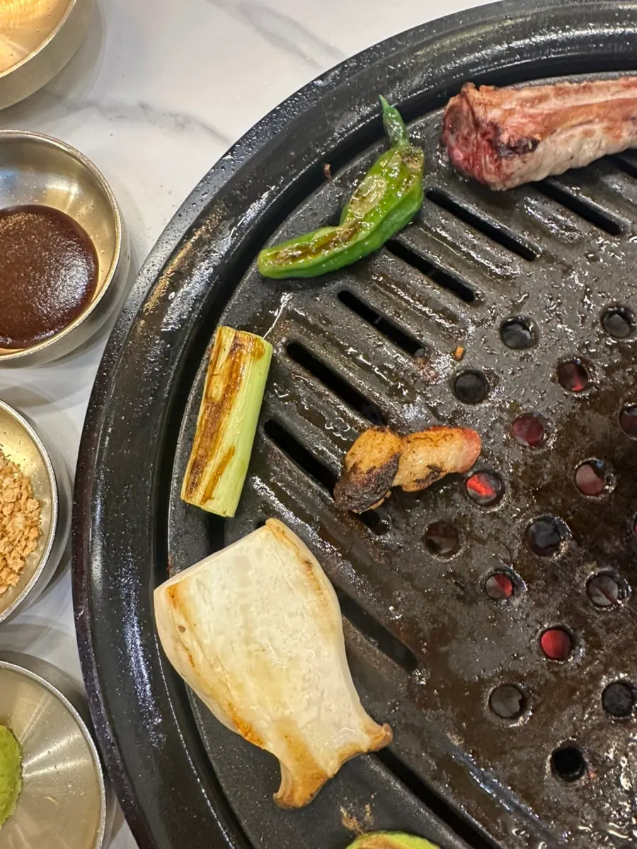 Zucchini and king oyster mushrooms grilled golden brown